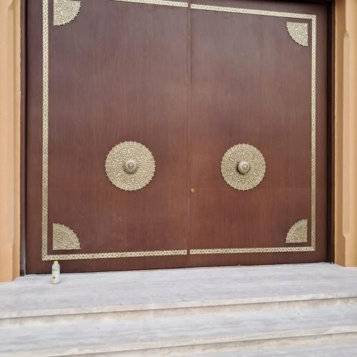 Metal door with wood finish and casted brass products 2